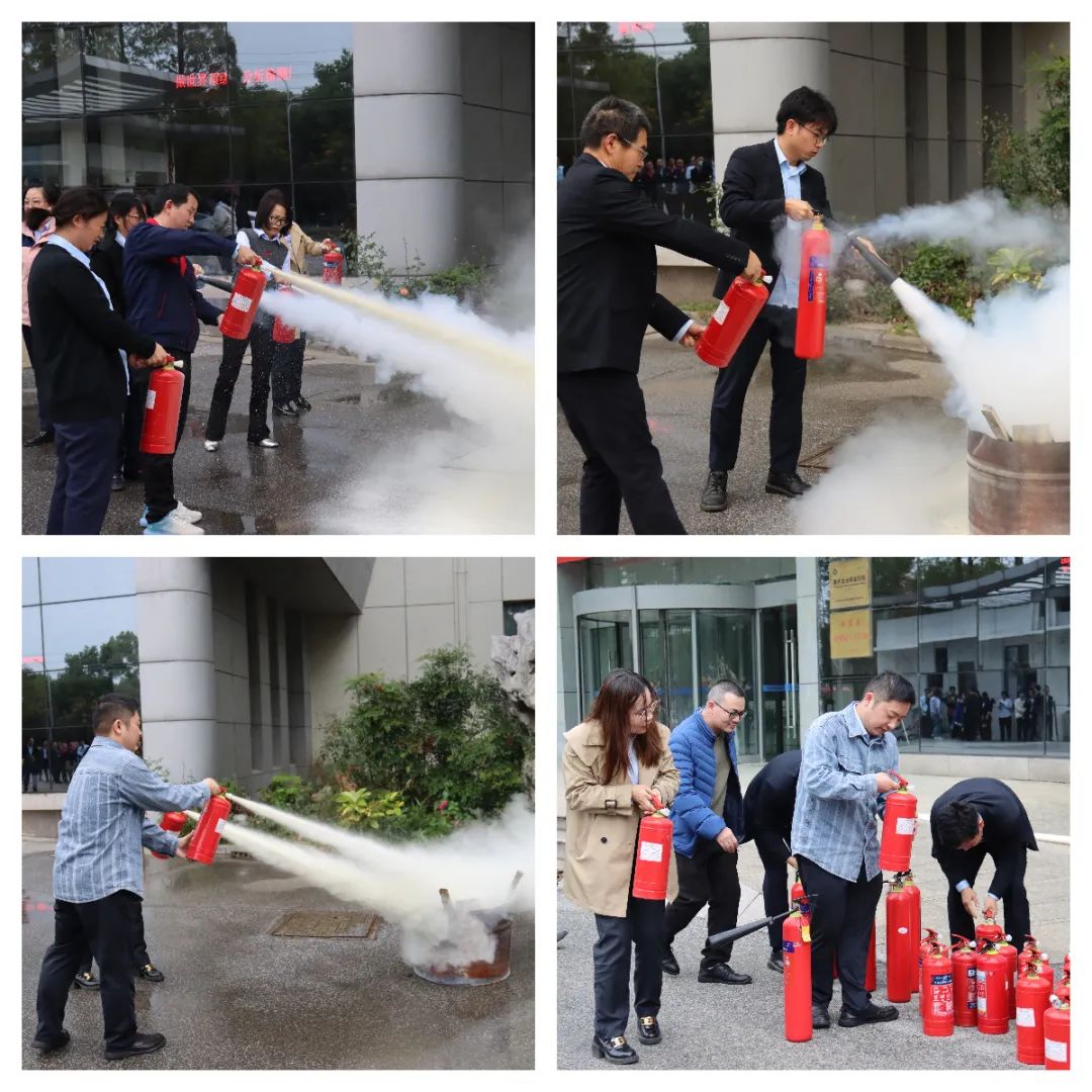 員工們手持滅火器參加現(xiàn)場滅火體驗 員工們手持滅火器參加現(xiàn)場滅火體驗